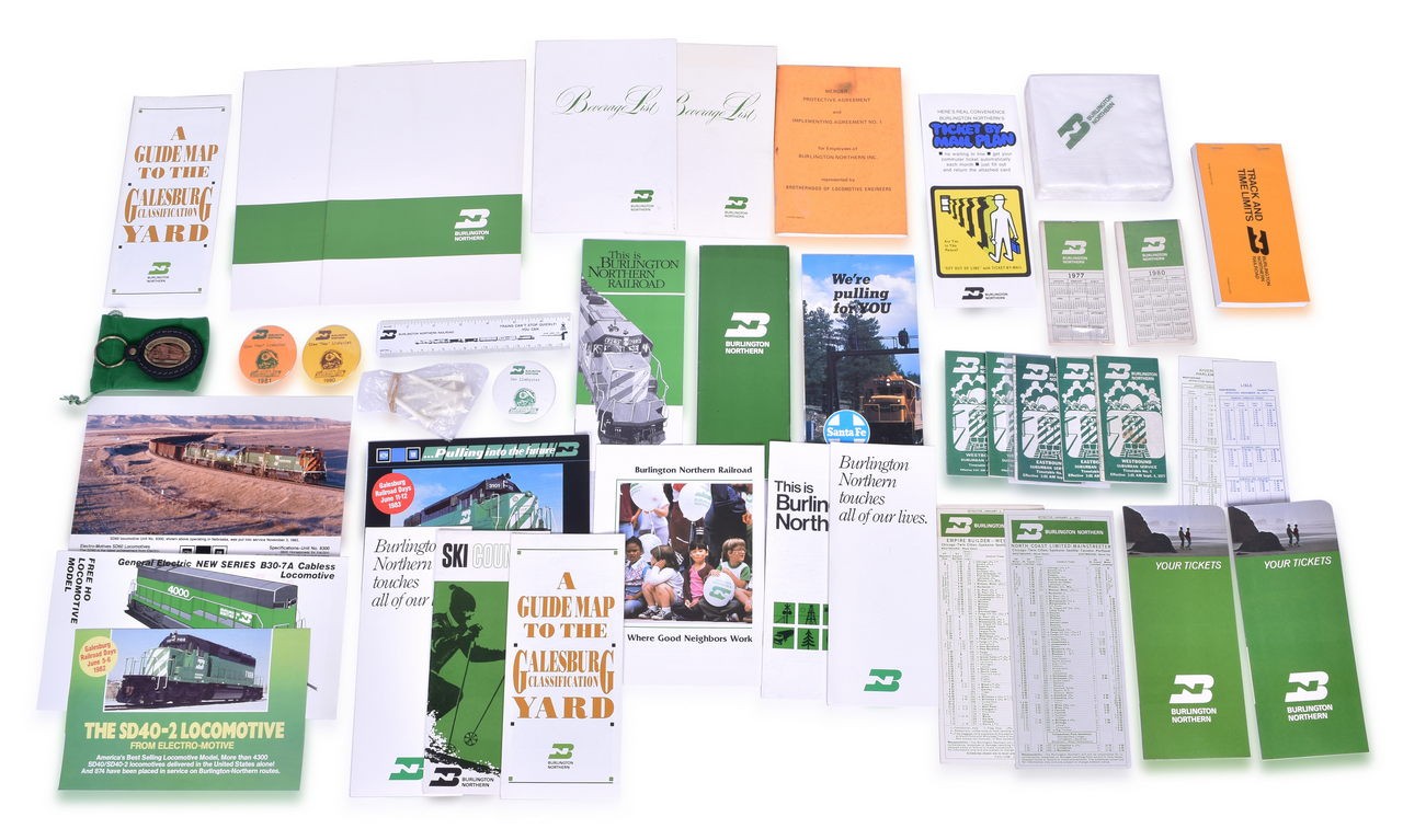 4019 - Large Group of 60 Burlington Northern Railroad Items - Timetables, Promotional Items, Paper, Napkins, and Keychain thumbnail