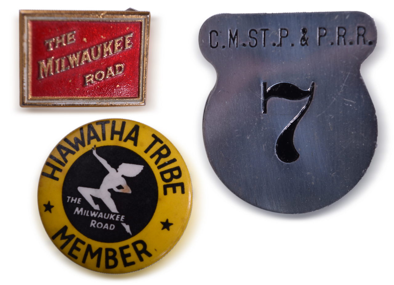 8594 - Three Milwaukee Road Pins - Waiter Badge, Lapel Pin, and Children's Hiawatha Tribe Pin thumbnail