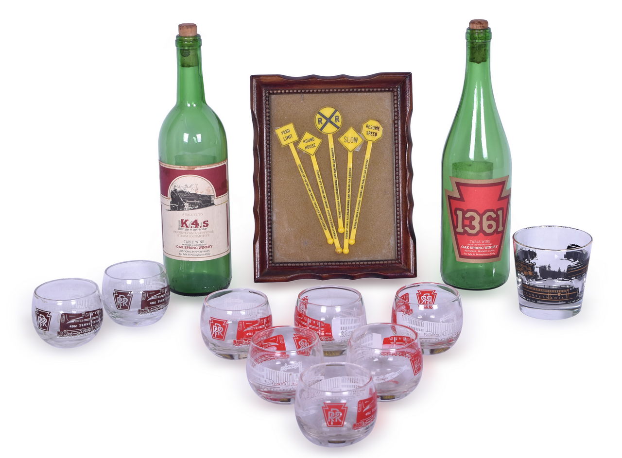 1015 - Sixteen Pieces of Pennsylvania Railroad Dining Car Drinking Items - Glasses, K.4.s Wine Bottles, and Swizzle Sticks thumbnail