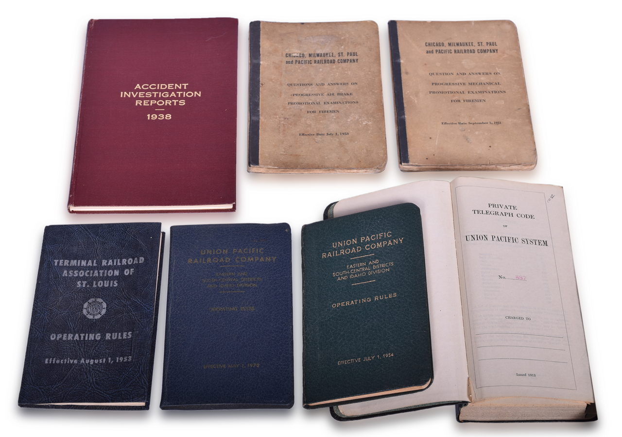 2697 - Seven Assorted Railroad Books - Union Pacific Operating Rules and Telegraph Code Book, Milwaukee Road Exam Questions, and More thumbnail