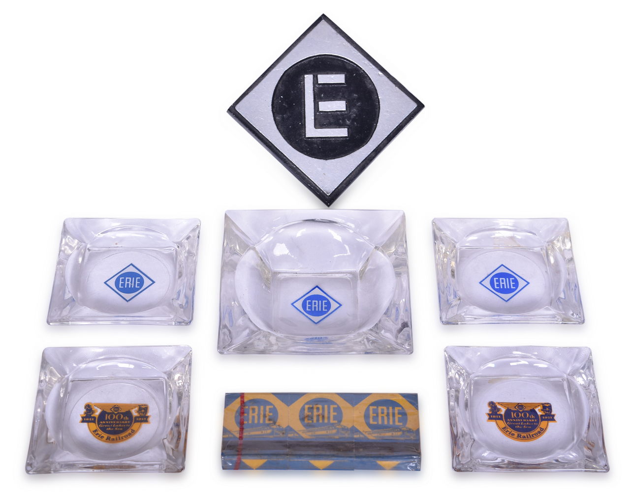 4144 - Five Erie Railroad Glass Ashtrays, Sealed Matches, and Aluminum Paperweight thumbnail