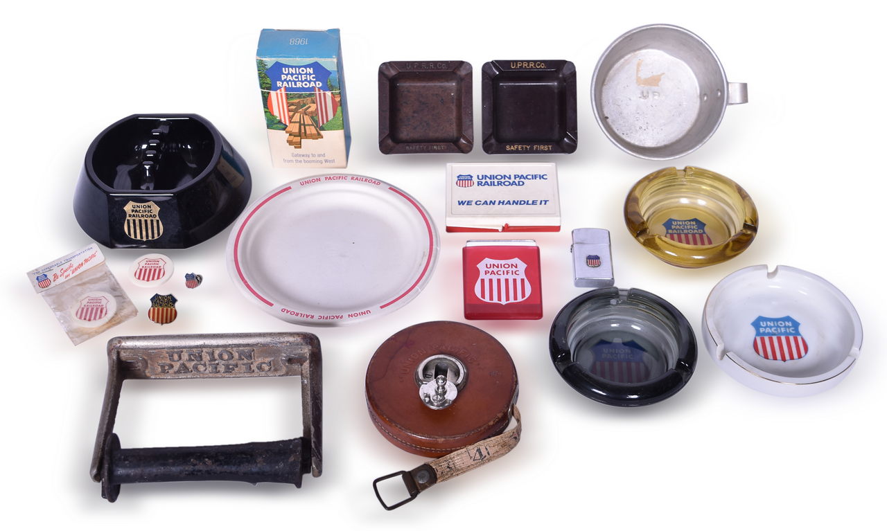 4146 - Eighteen Peices of Union Pacific Railroad Ephemera- Ashtrays, Lighter, Tin Cup, Buttons, and More thumbnail