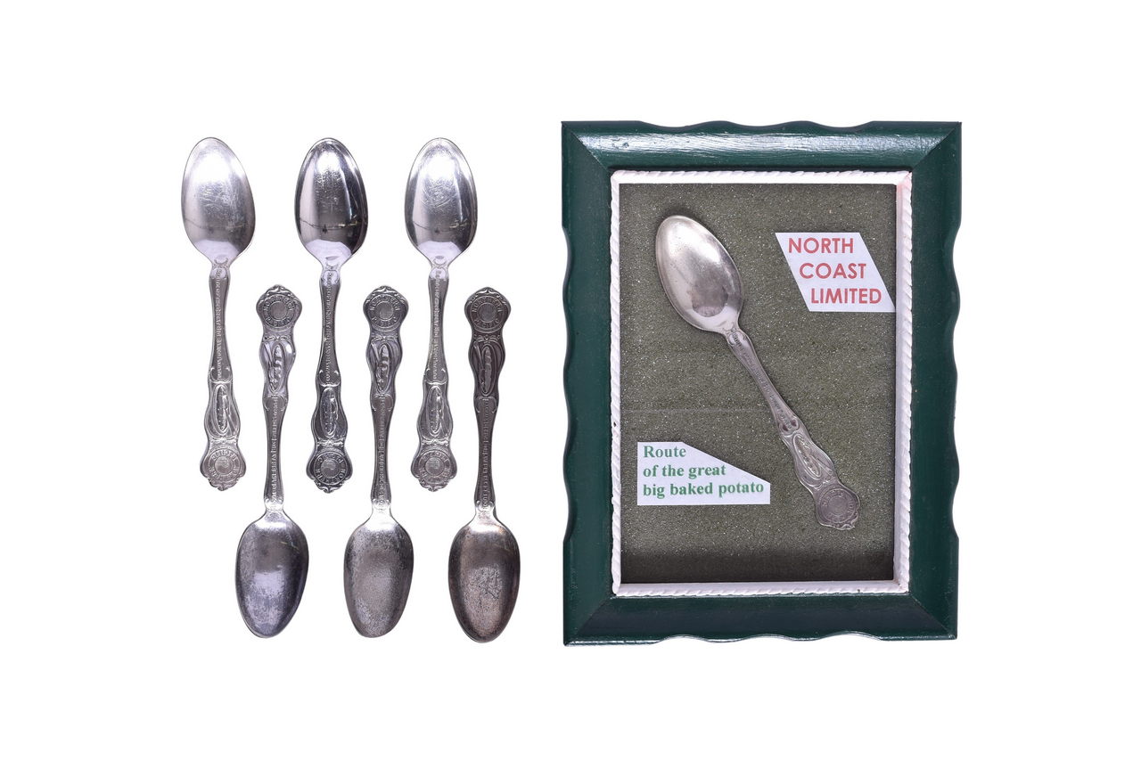 1543 - Seven Northern Pacific Railroad Route of the Great Big Baked Potato Souvenir Spoons thumbnail