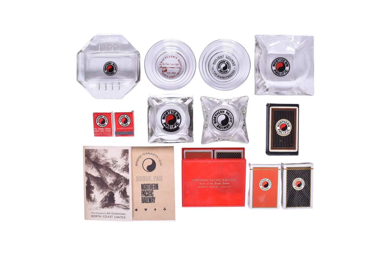 1627 - Group of Northern Pacific Railroad Ashtrays, Playing Cards, Score Pads, and Matchbooks thumbnail