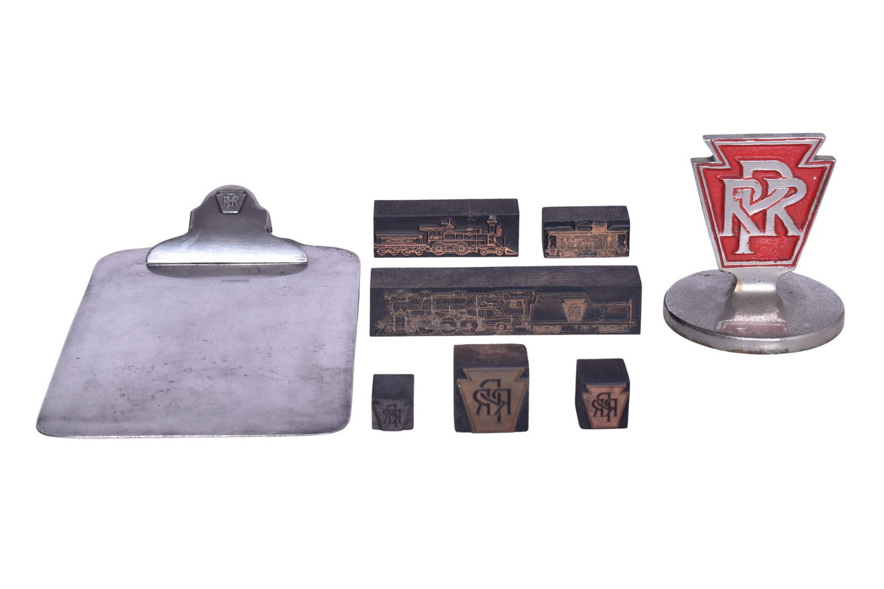 6237 - Group of Pennsylvania Railroad Desk Items - Clipboard, Paper Weight, and Wood Printing Block Stamps thumbnail