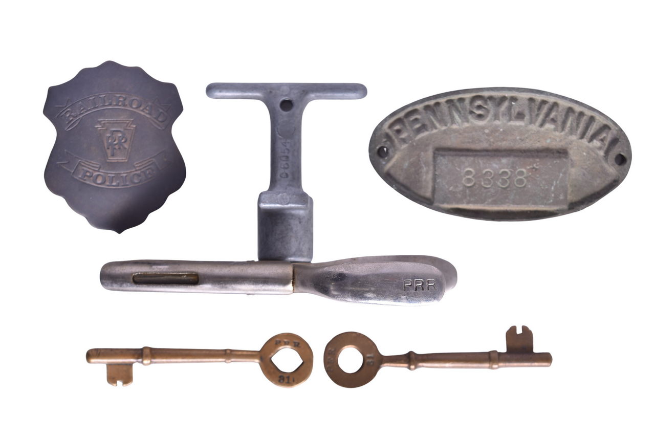 6259 - Assorted Pennsylvania Railroad Items - Police Badge, Coach Keys, Property Plate, and Ticket Punch thumbnail