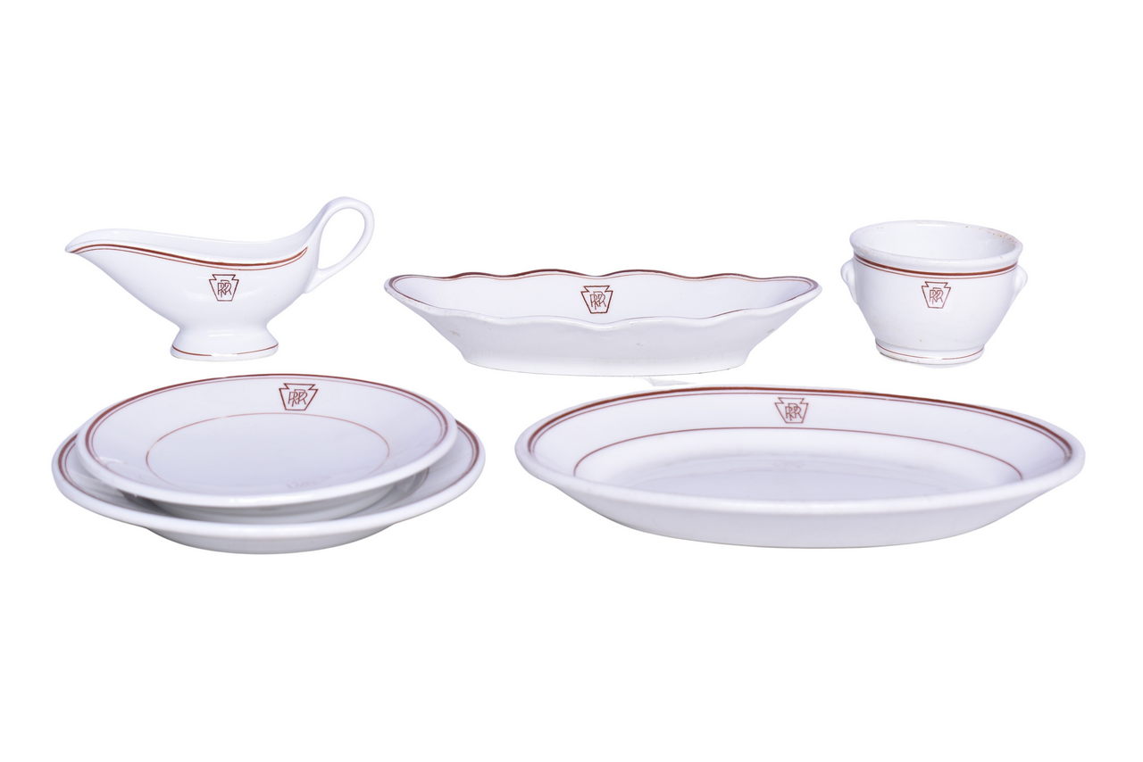 6407 - Six Pieces of Pennsylvania Railroad Keystone China Oval Celery Tray, Gravy Boat, Double Egg Cup, Oval Platter, and Plates thumbnail
