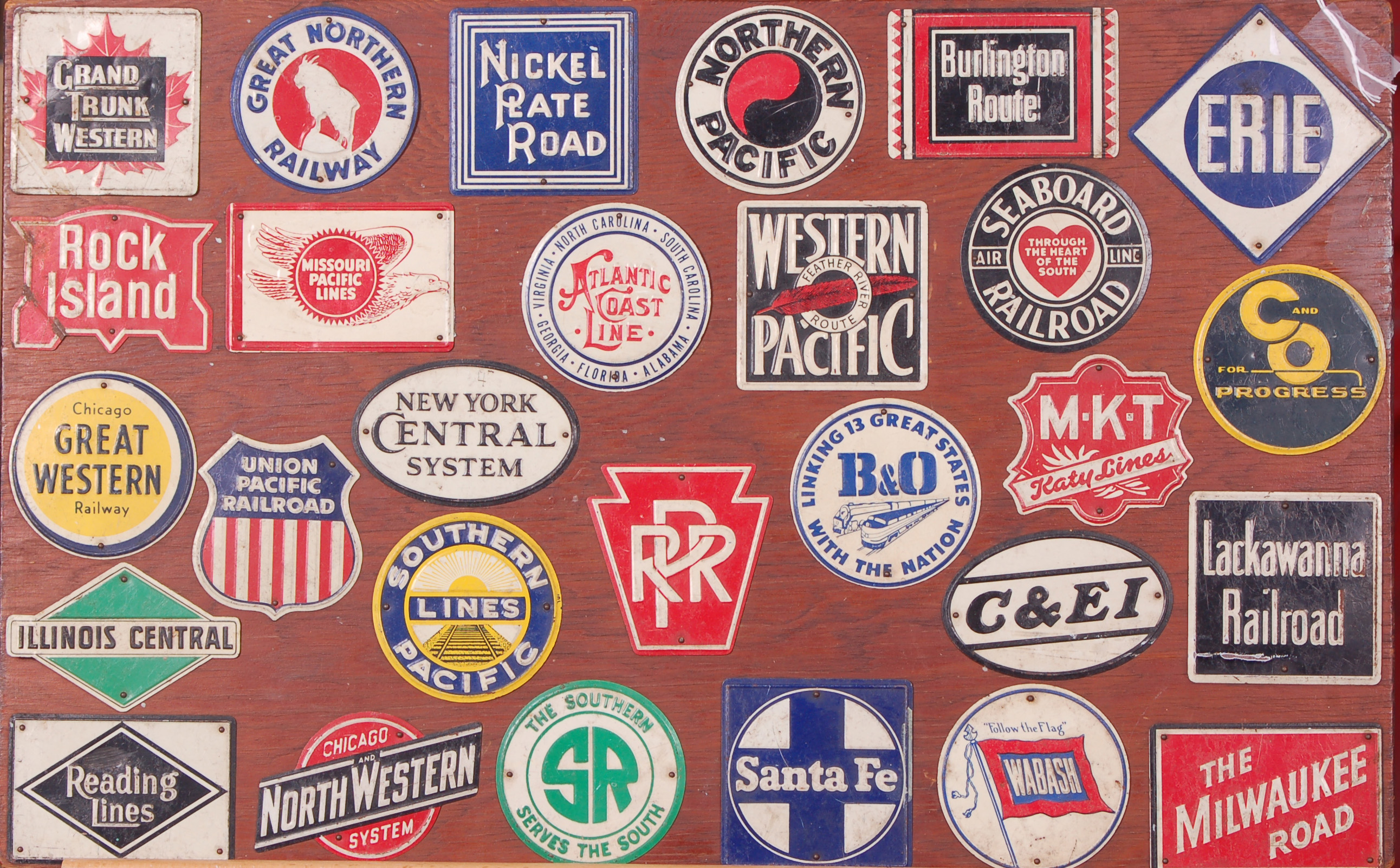 10 - Post Cereal Railroad LogoTins circa 1952-1955 - 28 piece set mounted on a wooden board thumbnail