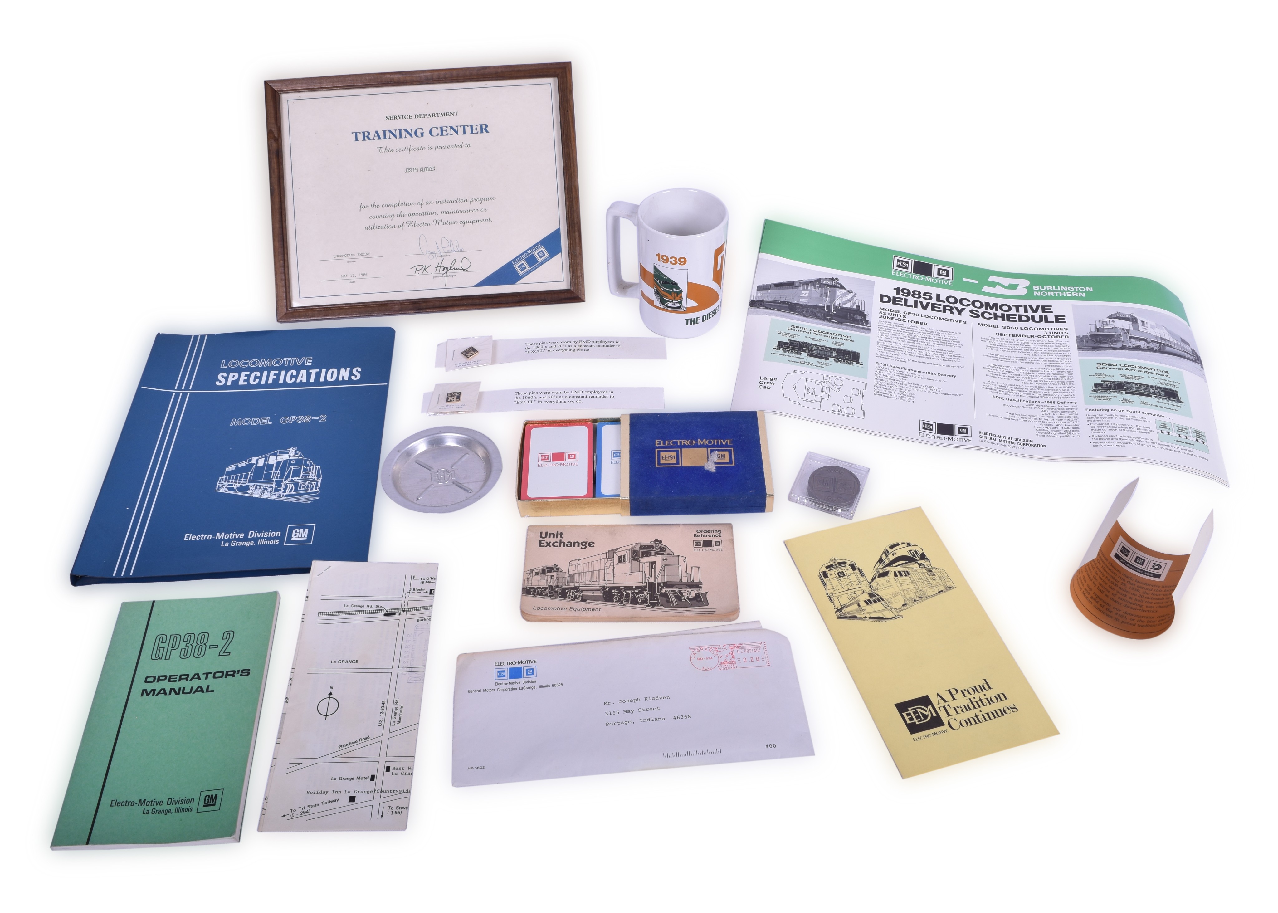 241 - Electro-Motive / EMD Railroadiana Lot- GP38-2 Specifications, Challenge Coins, Posters, Playing Cards, Certificates, and More thumbnail