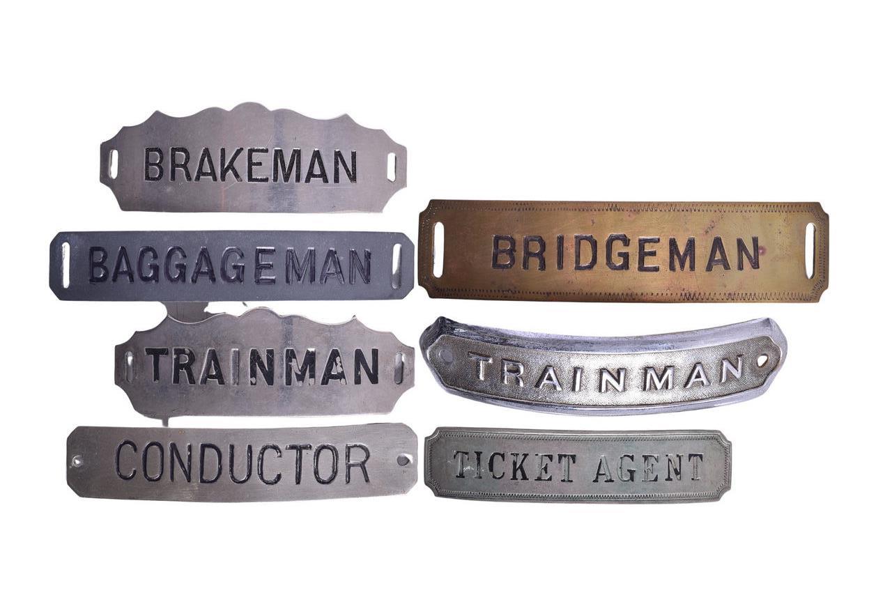 1520 - Seven Railroad Uniform Badges - Conductor, Bridgeman, Ticket Agent, Brakeman, Trainman thumbnail